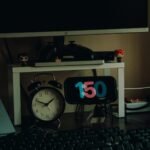 Organized home workspace featuring desk decor, clocks, and modern desk setup for productivity.