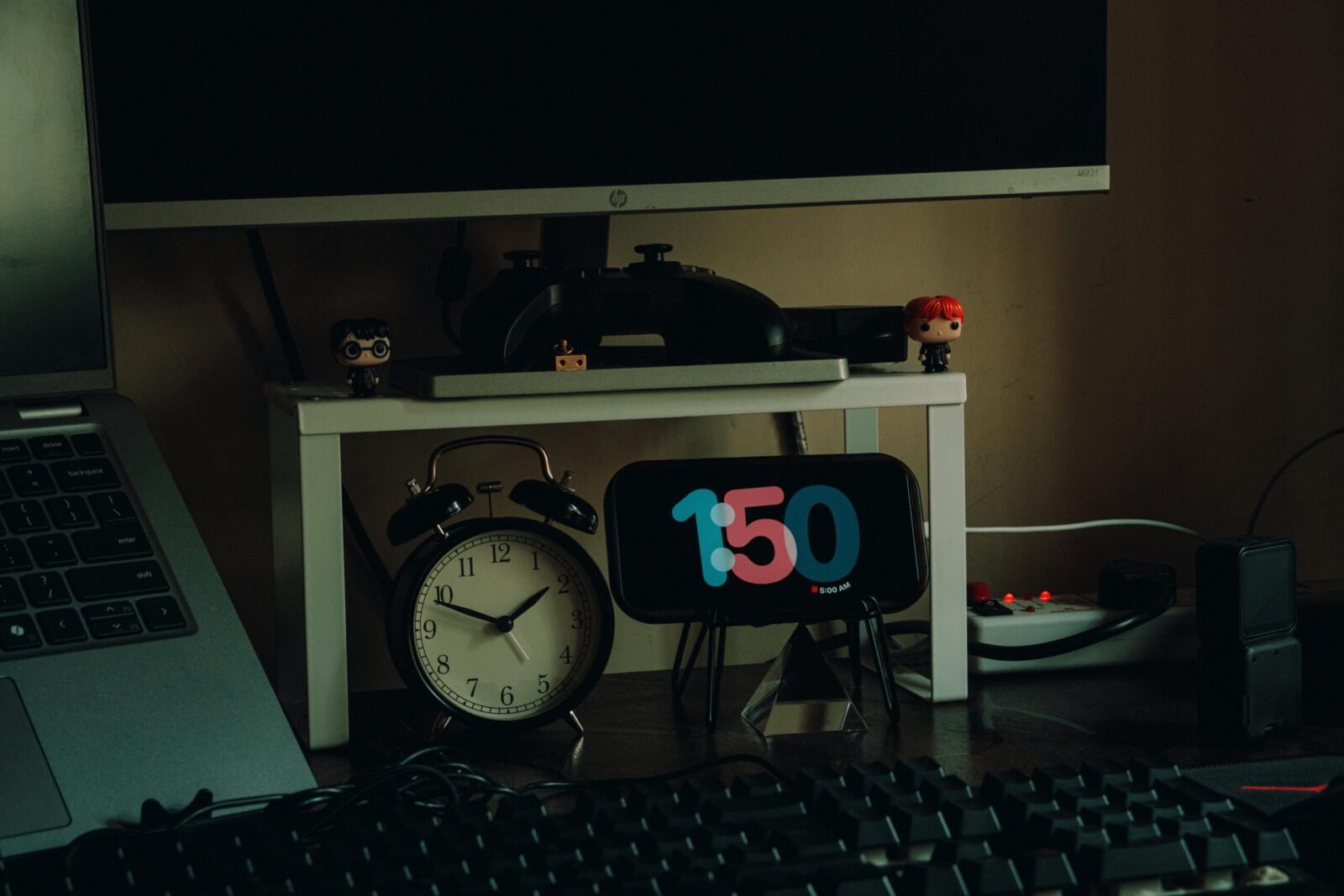 Organized home workspace featuring desk decor, clocks, and modern desk setup for productivity.